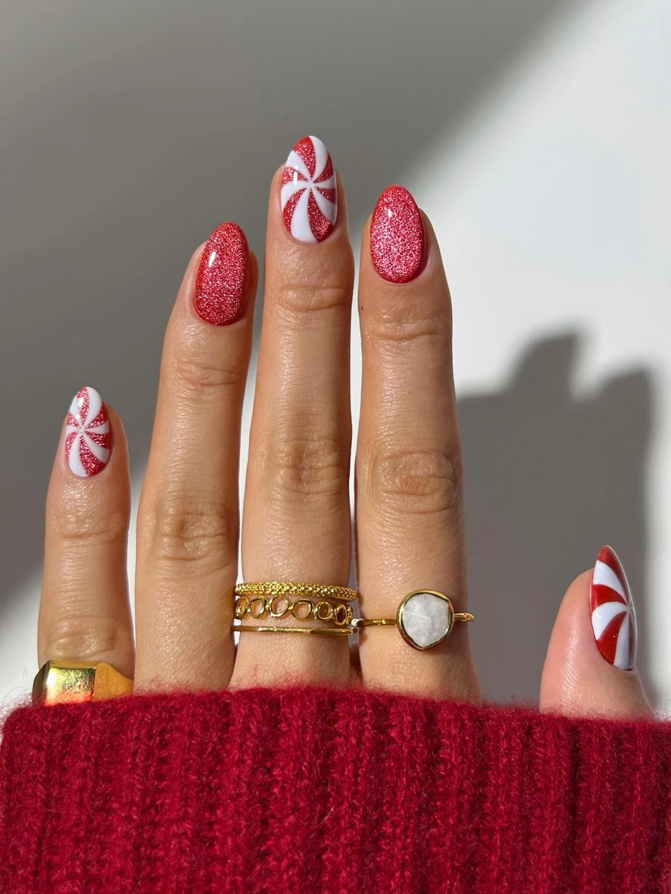30 Simple Candy Cane Christmas Nail ideas That Look Super Cute 2 Christmas Candy Cane Nails with Glitter Accents